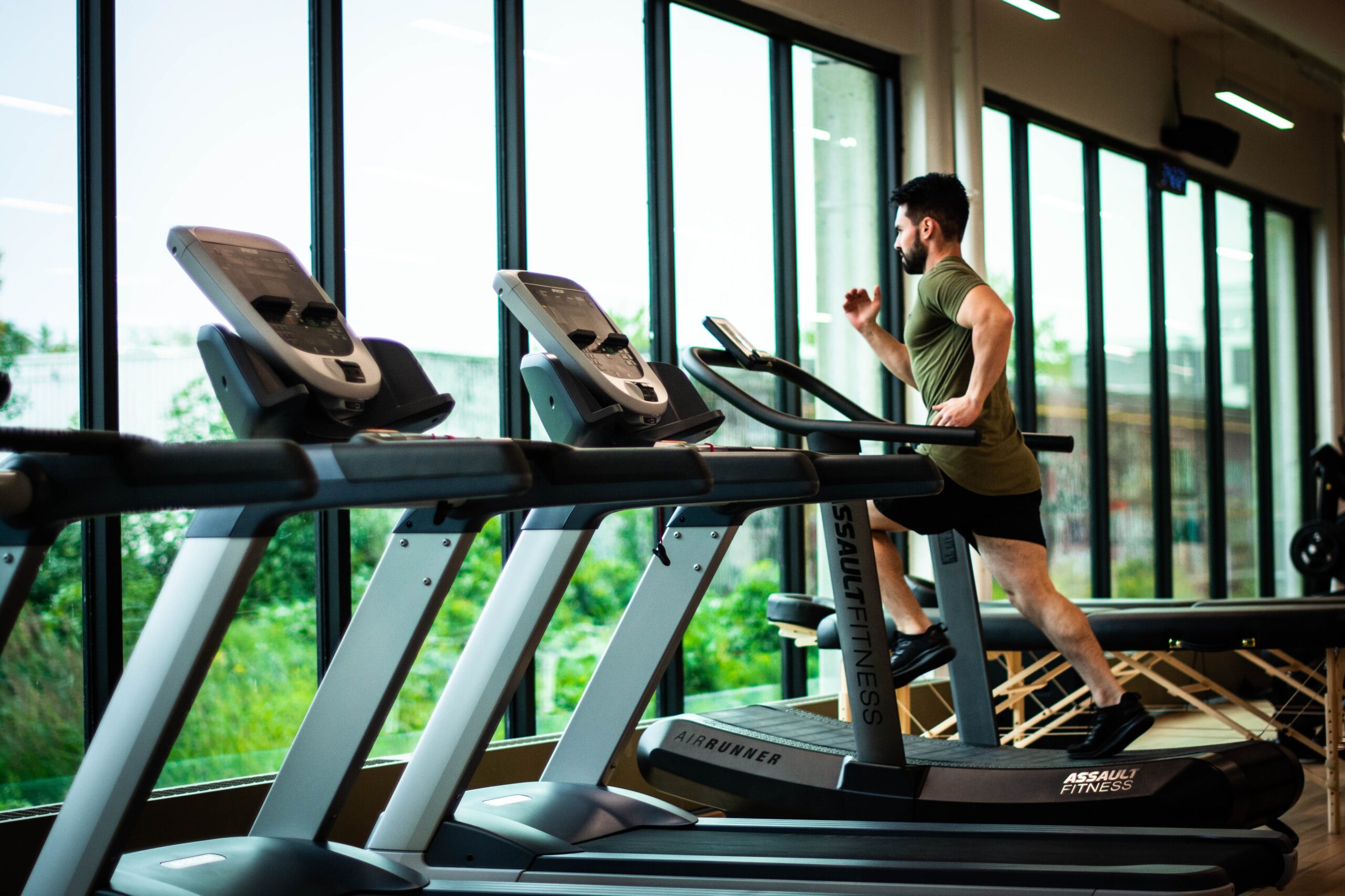 Man running on treadmill. Your bone health and excercise image